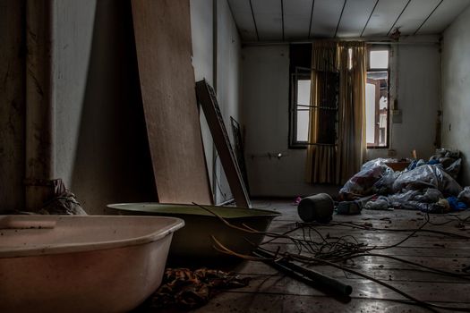 Bangkok, Thailand - Jan 19, 2020 : Abandoned room with baby bath was left to deteriorate over time, Abandoned house, Destroyed house, Ruined house.