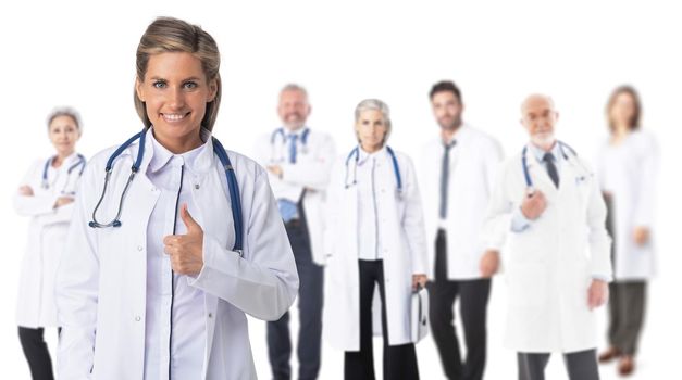 Healthcare and medical concept - group of doctors isolated on white background, woman with thumb up