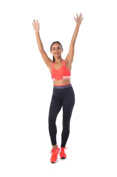 Healthy hispanic fitness girl with arms raised working out isolated on white background