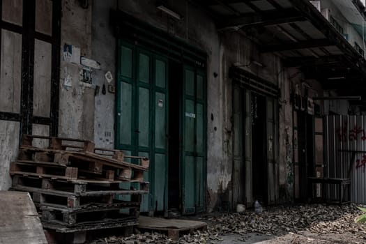 Bangkok, Thailand - Jan 19, 2020 : External of old house was left to deteriorate over time, Chinese Architecture style, Abandoned house, Destroyed house, Ruined house.