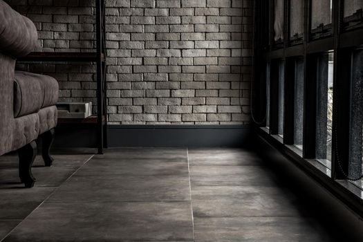 Bangkok, Thailand - 15 Dec 2019 : Minimalist interior of living room with sofa, brick wall and windows, Loft style room. Copy space.