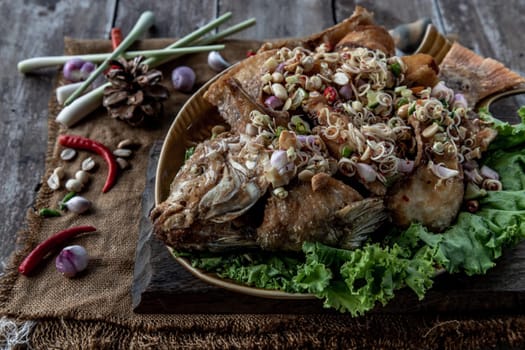 Deep fried whole Tubtim fish with spicy lemongrass salad, Thai food for health.