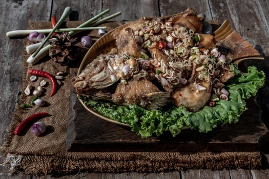 Deep fried whole Tubtim fish with spicy lemongrass salad, Thai food for health.