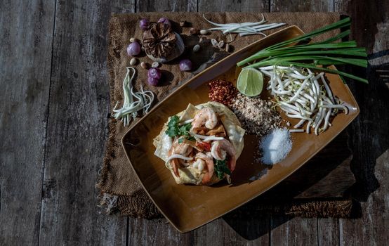 Fried Thai Noodle with Shrimp Wrapped in Egg (Pad Thai), That popular food for foreigner tourists, Top view.