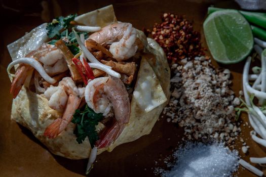 Close-up of Fried Thai Noodle with Shrimp Wrapped in Egg (Pad Thai), That popular food for foreigner tourists.