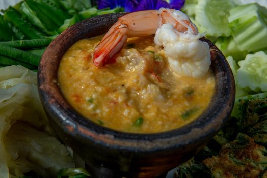 Thai Traditional Local Food : Shrimps chili dip or nam prik with shrimps (Nam Prik Goong Sod) with blanched vegetables and cha-om omelets.