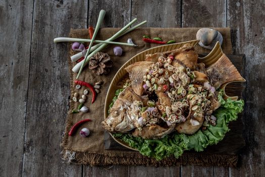 Deep fried whole Tubtim fish with spicy lemongrass salad, Thai food for health.