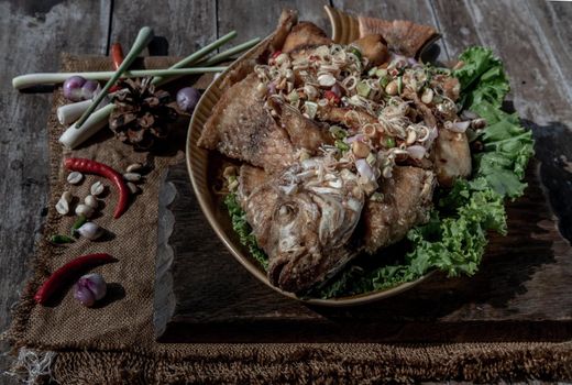 Deep fried whole Tubtim fish with spicy lemongrass salad, Thai food for health.