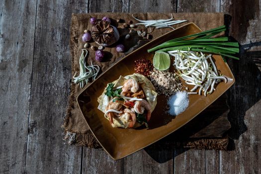 Fried Thai Noodle with Shrimp Wrapped in Egg (Pad Thai), That popular food for foreigner tourists, Top view.