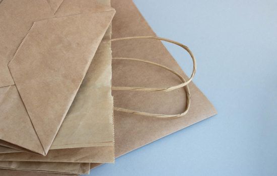 Eco-friendly packages on a gray background. The concept of a sustainable, environmentally friendly lifestyle.