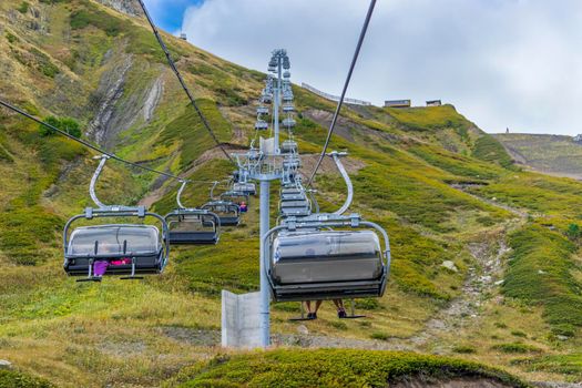 Sochi, Russia. Cable car with people on the background of mountains and sky.
