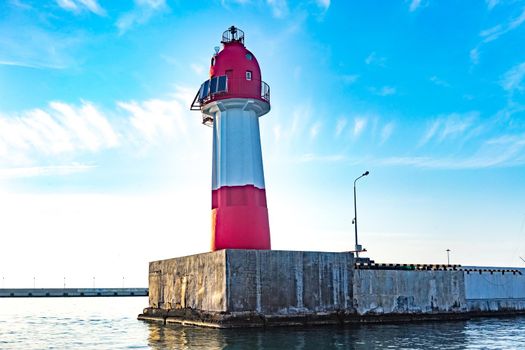 Sochi, Russia. Navigation lighthouse tower on the breakwater in the seaport.