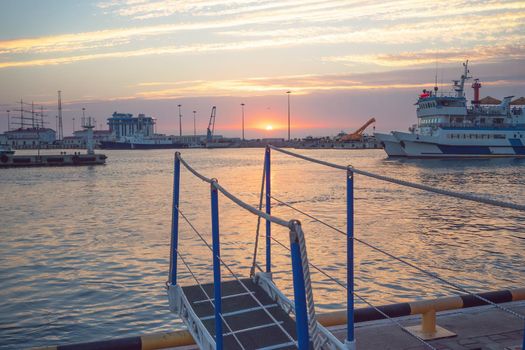 Sochi, Russia. Sea port with sunset view and ships.
