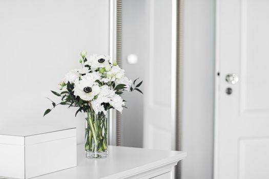 Bouquet of flowers in vase and home decor details, luxury interior design closeup