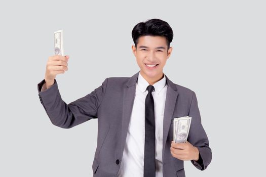 Young asian business man holding money dollar isolated on white background, businessman in suit holding banknote and success and excited with finance, savings and investment, income and spending.