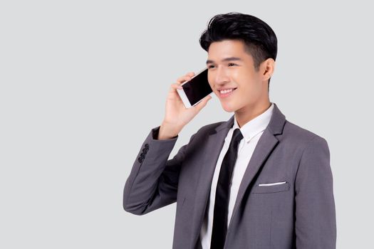 Young asian business man in suit talking on mobile phone isolated on white background, businessman speaking and listening smartphone with conversation, male holding cell phone, communication concept.