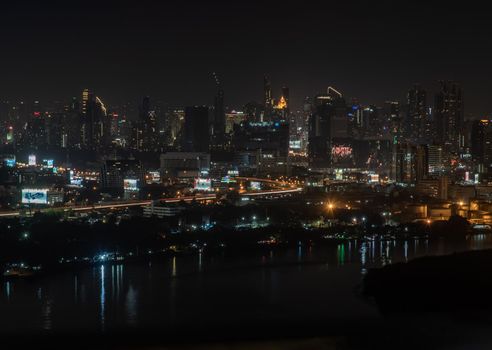 Bangkok, thailand - Nov 23, 2019 : Beautiful view of Bangkok city, Beauty skyscrapers along Chaopraya river in the night, making the city modern style.