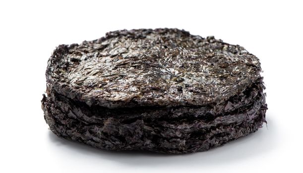 Close up of dried seaweed sheet healthy food isolated on white table background