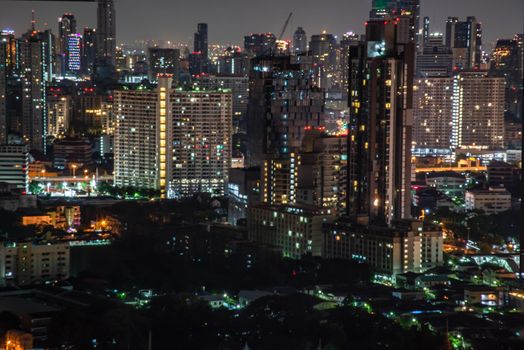 Bangkok, thailand - Oct 18, 2019 : Sky view of Bangkok with skyscrapers in the business district in Bangkok In the night beautiful twilight give the city a modern style.