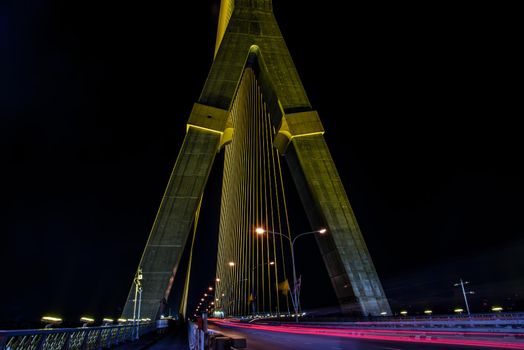 Bangkok, thailand - Nov 23, 2019 : Night sky at road on Rama VIII Bridge with car trails at twilight time in Bangkok, Thailand