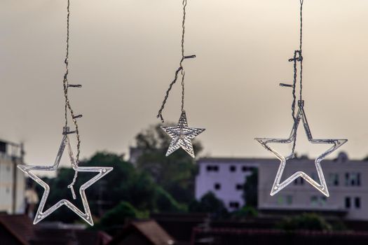Preparation of lighted decorations on the rooftop for Xmas Holiday and New year festival in bangkok, copy space.