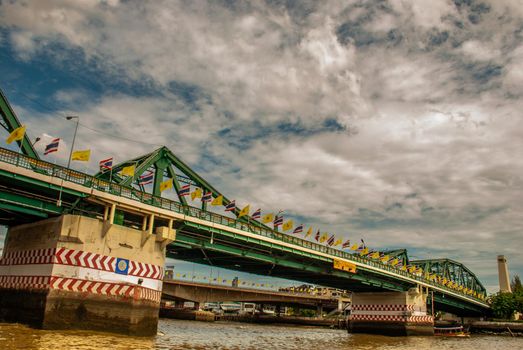 Phra Phuttha Yodfa Bridge (Memorial Bridge) is a bridge over the Chao Phraya River connecting the districts Phra Nakhon and Thonburi, Can be opened to larger ships, Vintage Style.