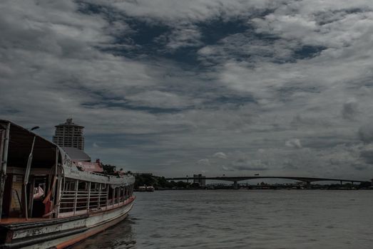Bangkok, Thailand, 21 Jul 2019: View of the Chao phraya Express Boat and Krung Thep Bridge in the background.