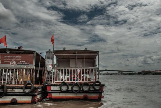 Bangkok, Thailand, 21 Jul 2019: View of the Chao phraya Express Boat and Krung Thep Bridge in the background.