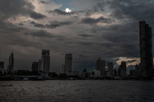 Bangkok, Thailand - 21 Jul 2019: Skyscrapers along the Chao Phraya River in the evening Making Bangkok a beautiful city.