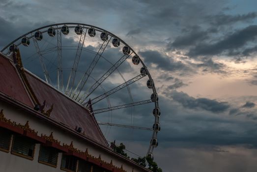Bangkok, thailand 21 Jul, 2019 : Wat Ratcha Singkhon with Asiatique Ferris Wheel and Blue Sky at the Background.