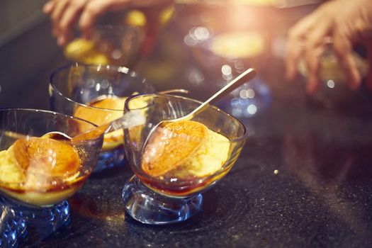 Caramel custard sweet on glass for catering dinner