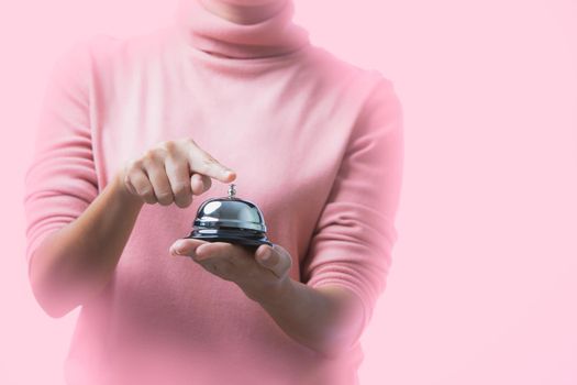 Woman with bell service on pink background