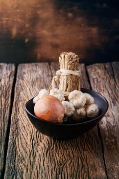 Still life with onions and garlics on wooden