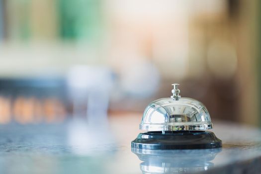 Bell on counter for service with blurred background