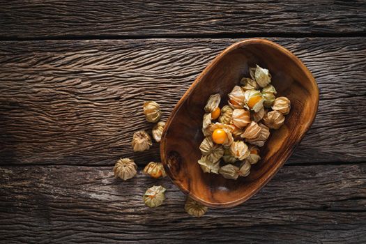 Cape Gooseberries in a group on wood