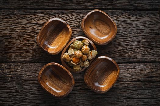 Cape Gooseberries in a group on wood