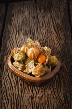 Cape Gooseberries in a group on wood