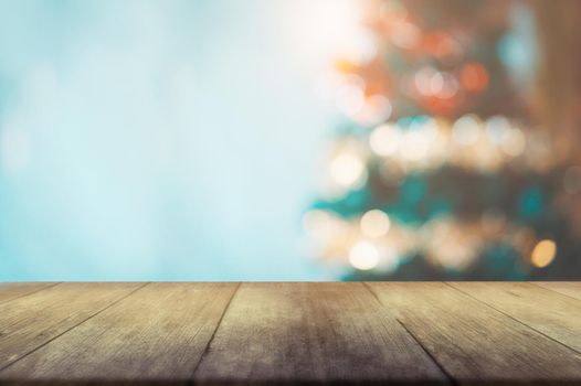 Christmas tree blurred on wooden with bokeh background