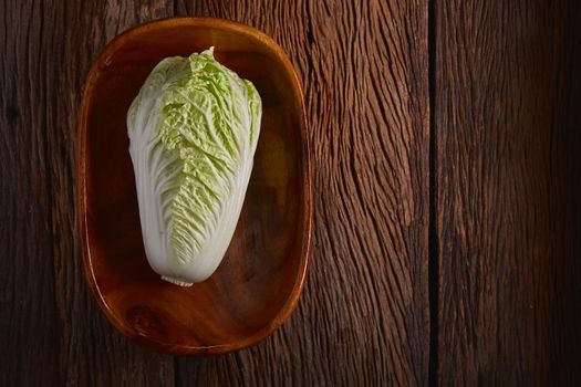 Still life with Chinese cabbage on wood