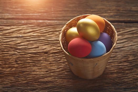 Egg Easter in basket on wooden
