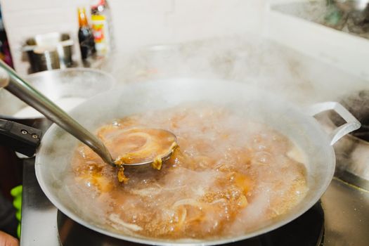 Boiling shark's fin soup. Traditional luxury menu of Chinese