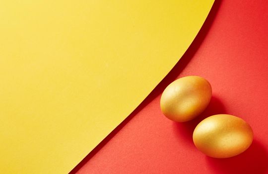 Couple Eggs Easter golden on two tone background