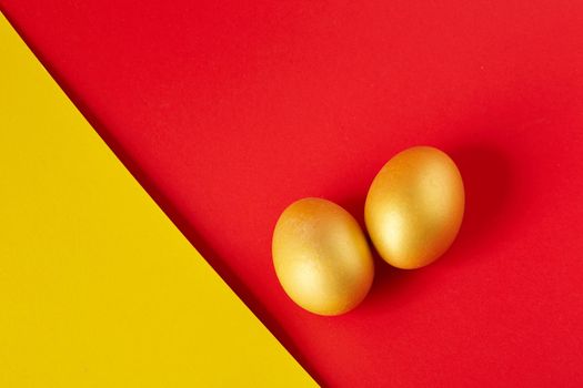 Couple Eggs Easter golden on two tone background