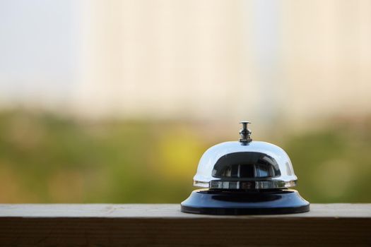 Bell on counter for service with blurred background