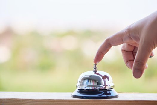 Bell on counter for service with blurred background