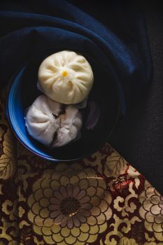 Still life with steamed bun on top view