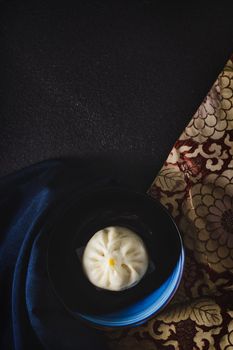 Still life with steamed bun on top view