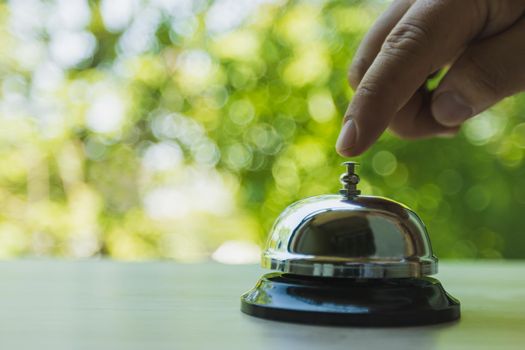 Bell service on counter information, Bell call for service with green bokeh background