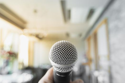 Microphone close up on blurred bokeh background