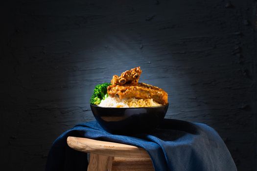 Still life with Baked Pork Ribs Rice on dark background